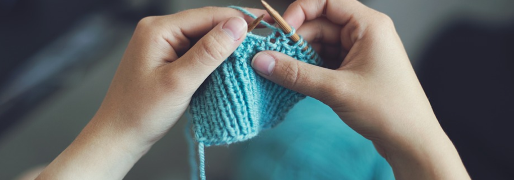 hands Crochet blue yarn